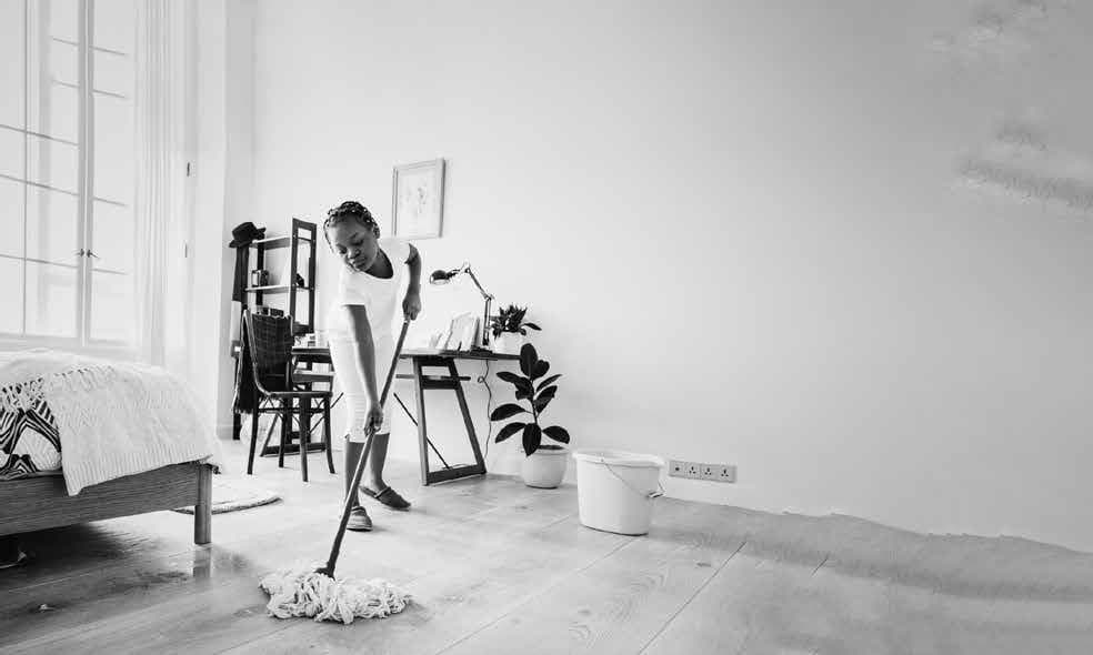 A bedroom being cleaned and reset